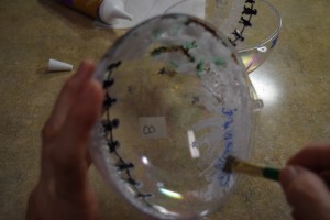 Painting the inside of the ornaments.